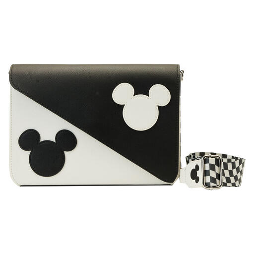 Black and white crossbody bag with a checkered strap. On the front, a Mickey Mouse head is in black on a white background and diagonally across from it is a white Mickey Mouse head on a black background.